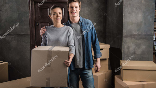 depositphotos_168314966-stock-photo-couple-with-cardboard-box-at